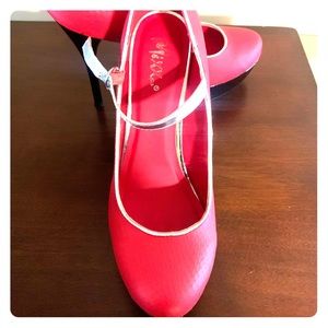 Judith Red heels with sliver trimming.